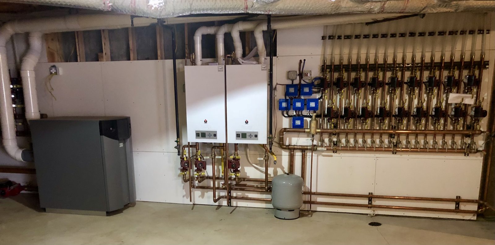 Finished hydronic mechanical room with boiler and near-boiler piping